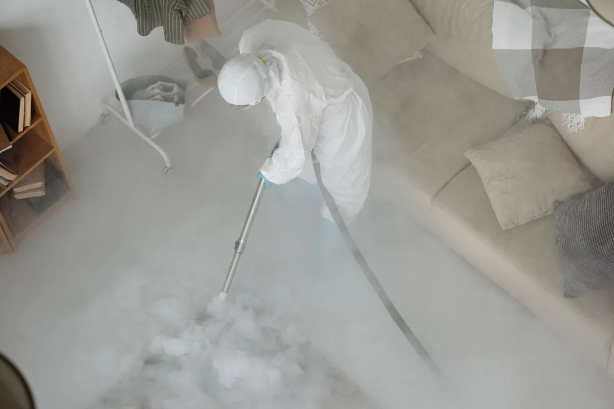 Biohazard cleanup technician in protective equipment, Gramercy, New York, NY